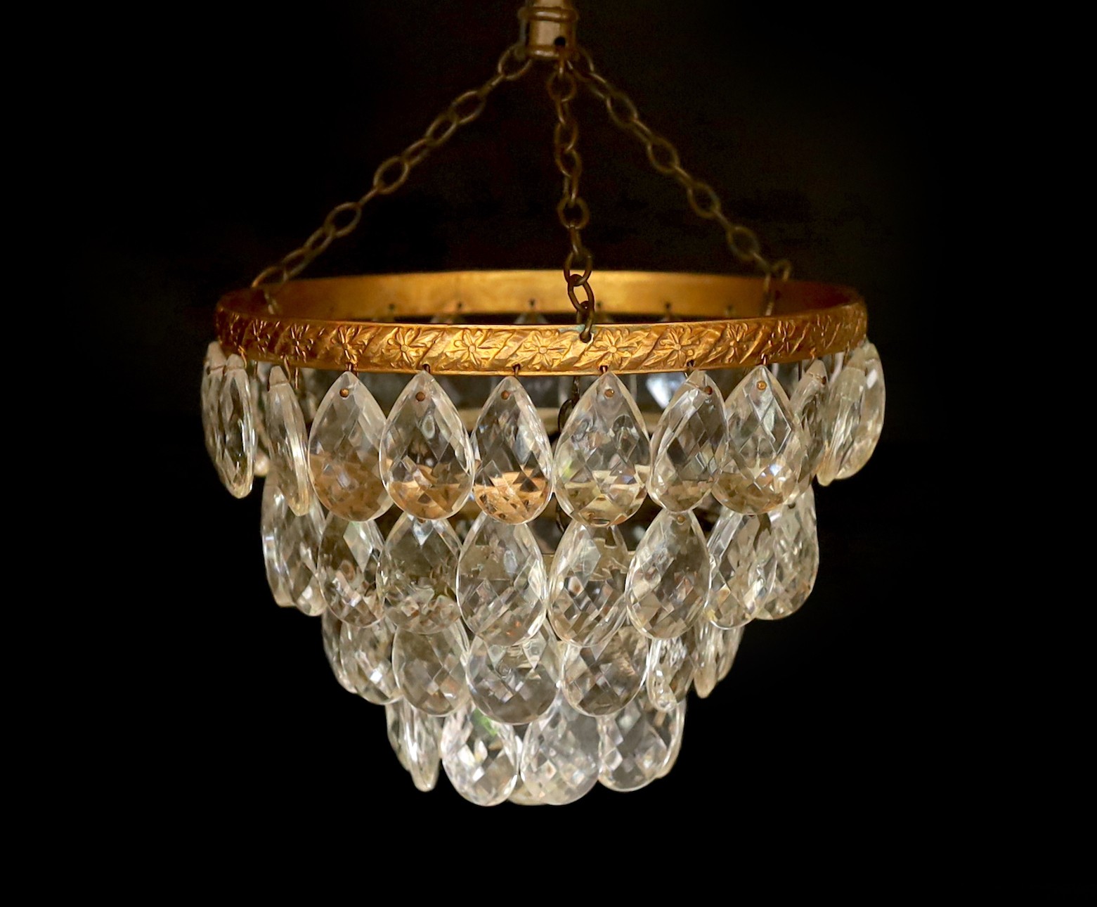 A small 1930s clear and green glass bag shaped light fitting and a brass mounted four tier fitting, drop 27cm and 20cm.
